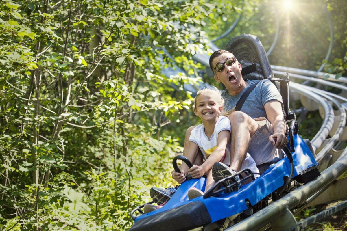 Parent and child on alpine coaster